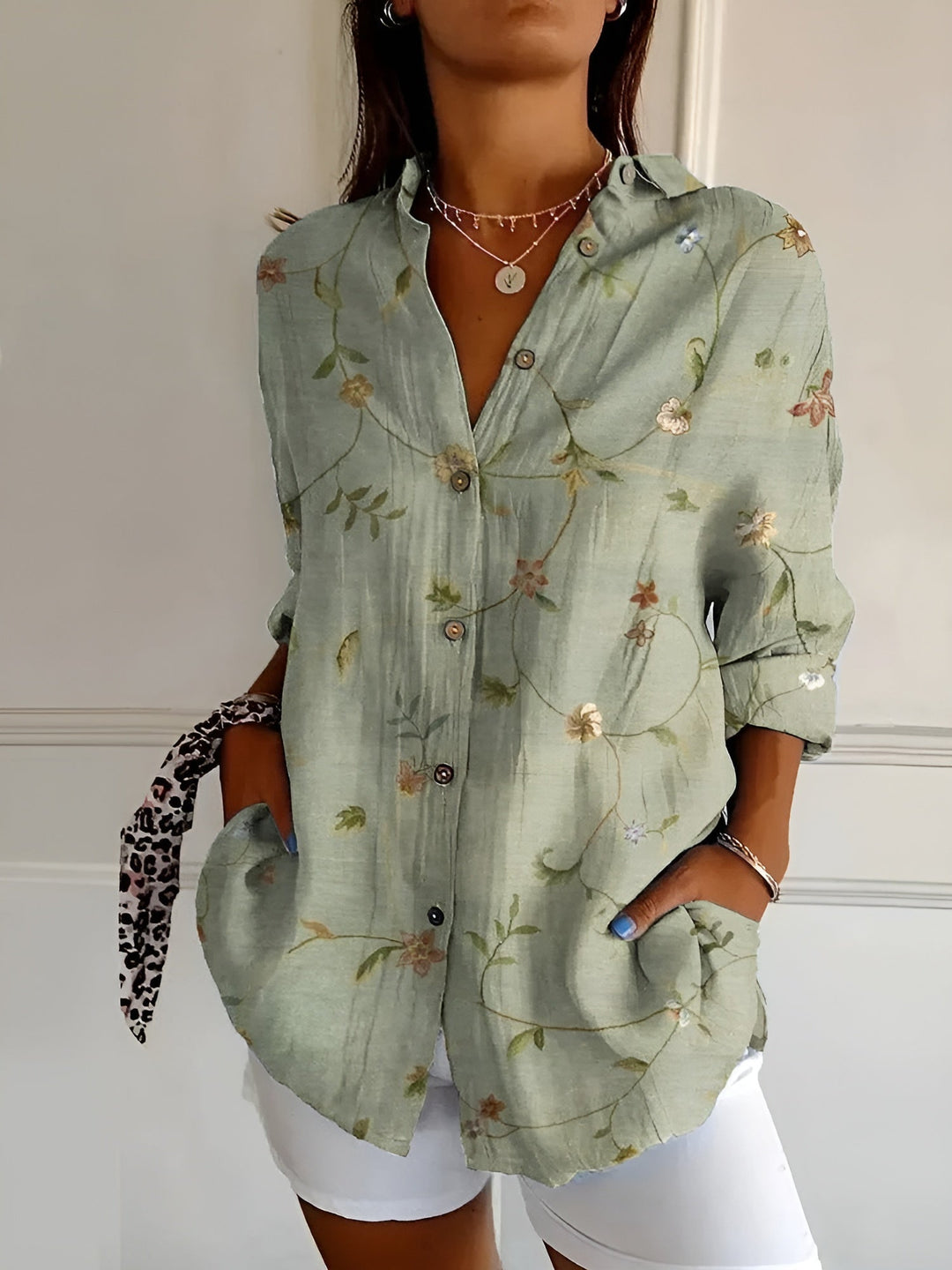 Chic patterned women's blouse, button-front with three-quarter sleeves, versatile for casual spring & summer outfits.