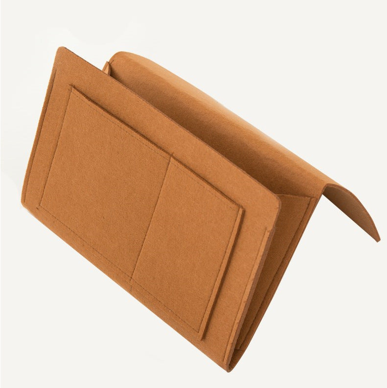 Bedside storage solution demonstrating its capacity to hold magazines, glasses, and a tablet.