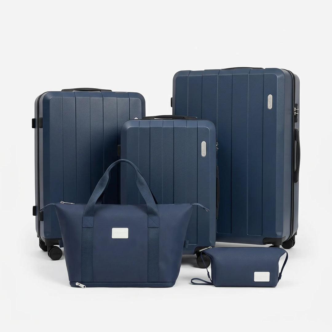 Durable 5-piece hard shell suitcase travel set with smooth spinner wheels, perfect for family airport trips.
