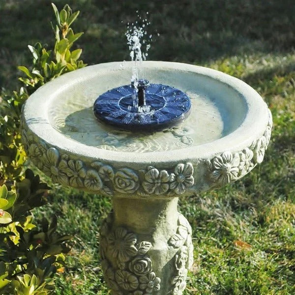 Floating solar water fountain pump for pond decor, garden, or bird bath. Eco-friendly, solar-powered water feature.