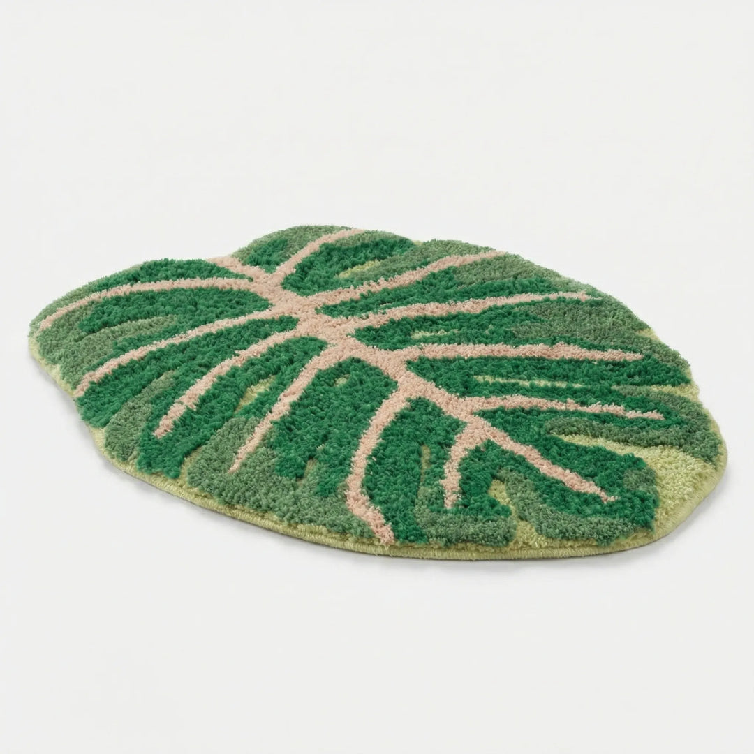 Green monstera banana leaf area rug, non-slip & washable, nature-inspired decorative floor mat for home decor.