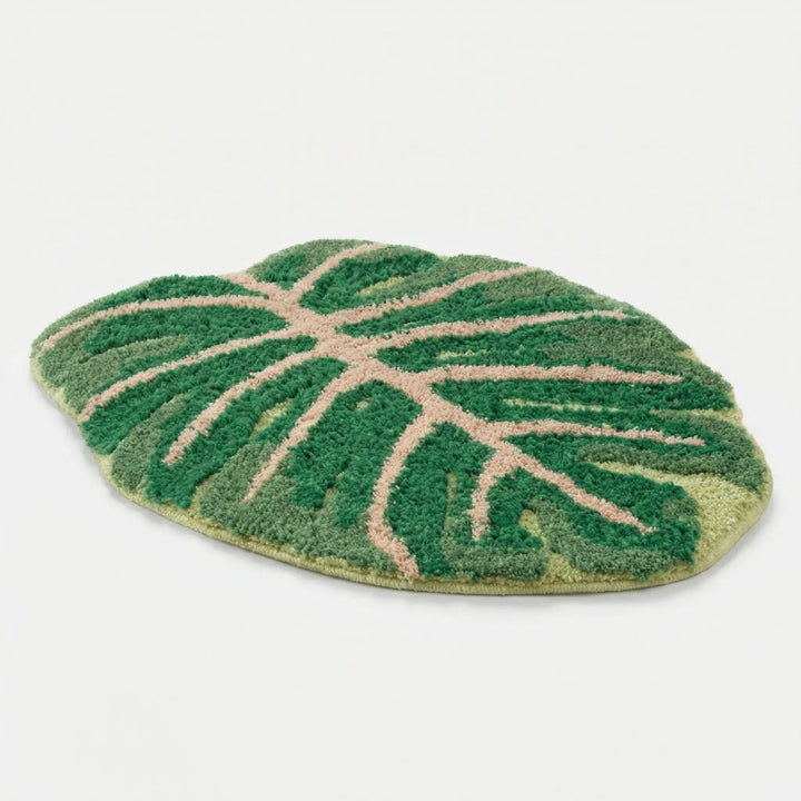 Green monstera banana leaf area rug, non-slip & washable, nature-inspired decorative floor mat for home decor.
