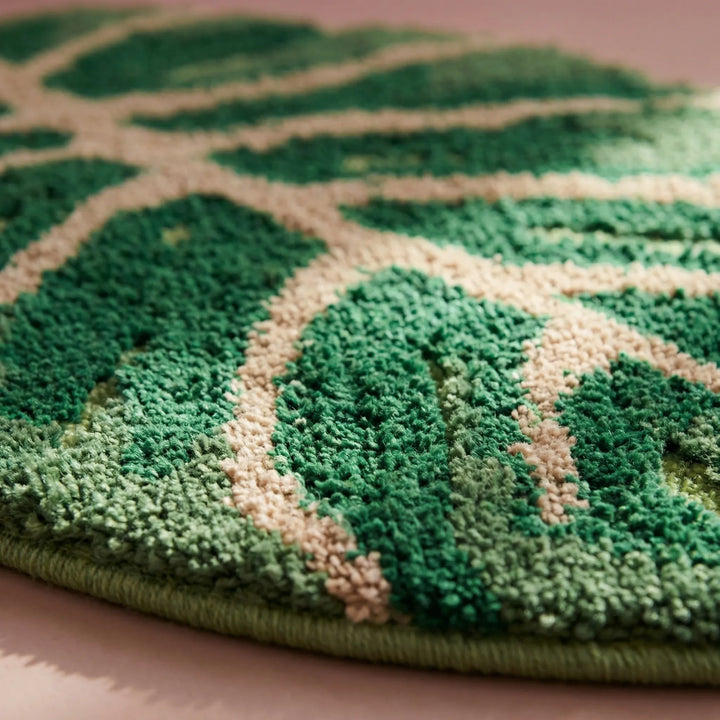 Soft botanical leaf area rug with wave pattern; green decorative indoor rug, perfect for a cozy living space.