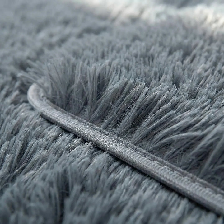 Washable indoor non-slip area rug, low pile, featuring a modern wave pattern, great as an entryway or bath mat.