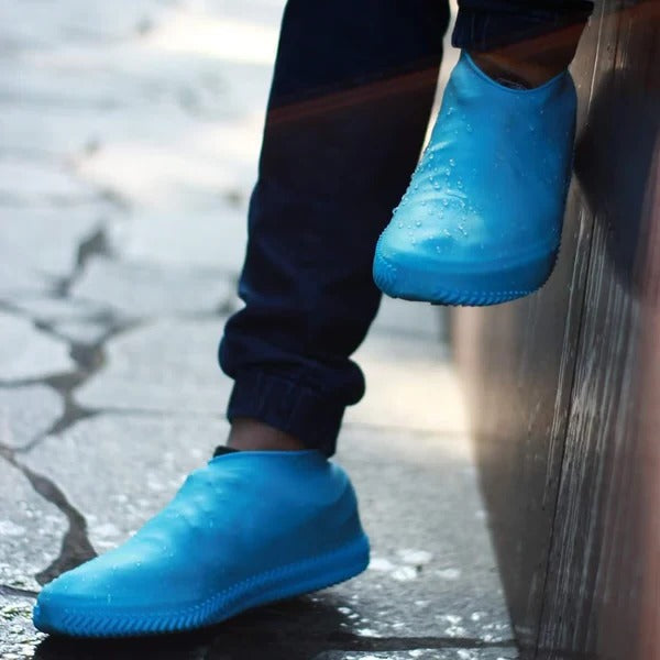 Reusable unisex weatherproof shoe covers protecting shoes from rain and mud during outdoor activities or travel.