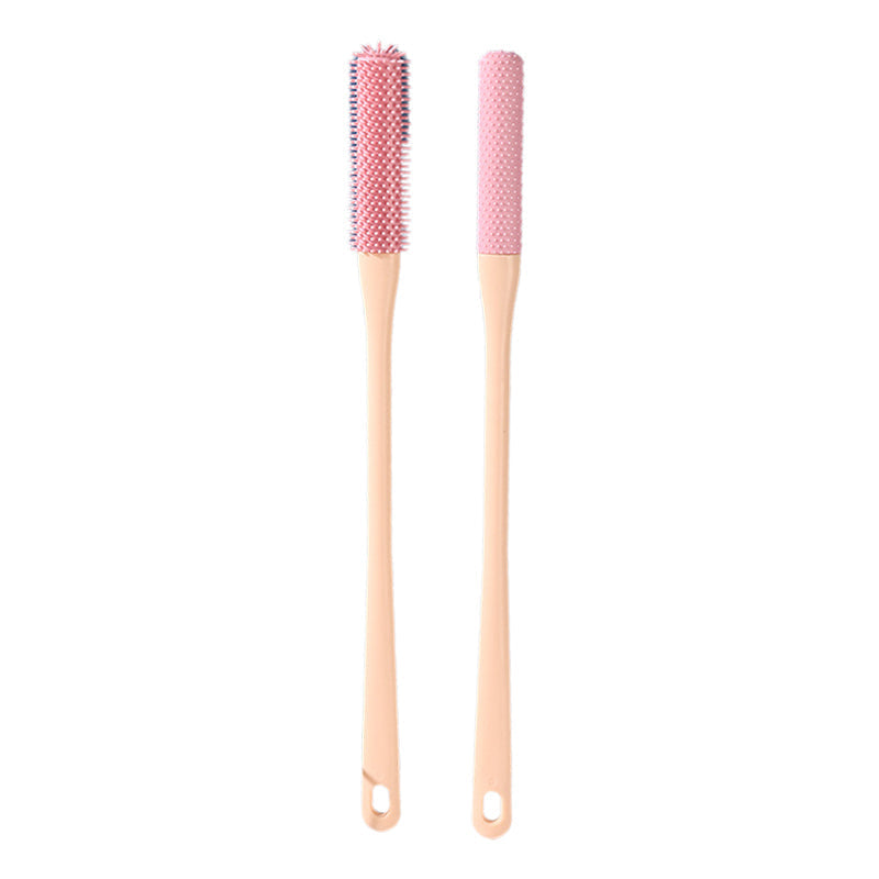 The anti-itch brush demonstrating its size, fitting comfortably in the palm of a hand