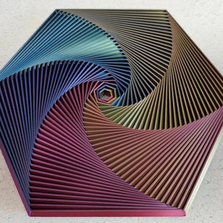 A singular Fractal Fidget Hexagon toy, casting a shadow, highlighting its unique design