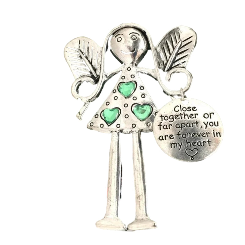 Hand holding Friendship Angel iron ornament, highlighting its unique design & sentimental value