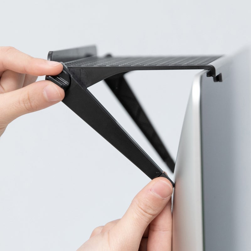 Front view of Universal Monitor Top Shelf Desk Organizer, black ABS plastic, extended to hold office accessories.