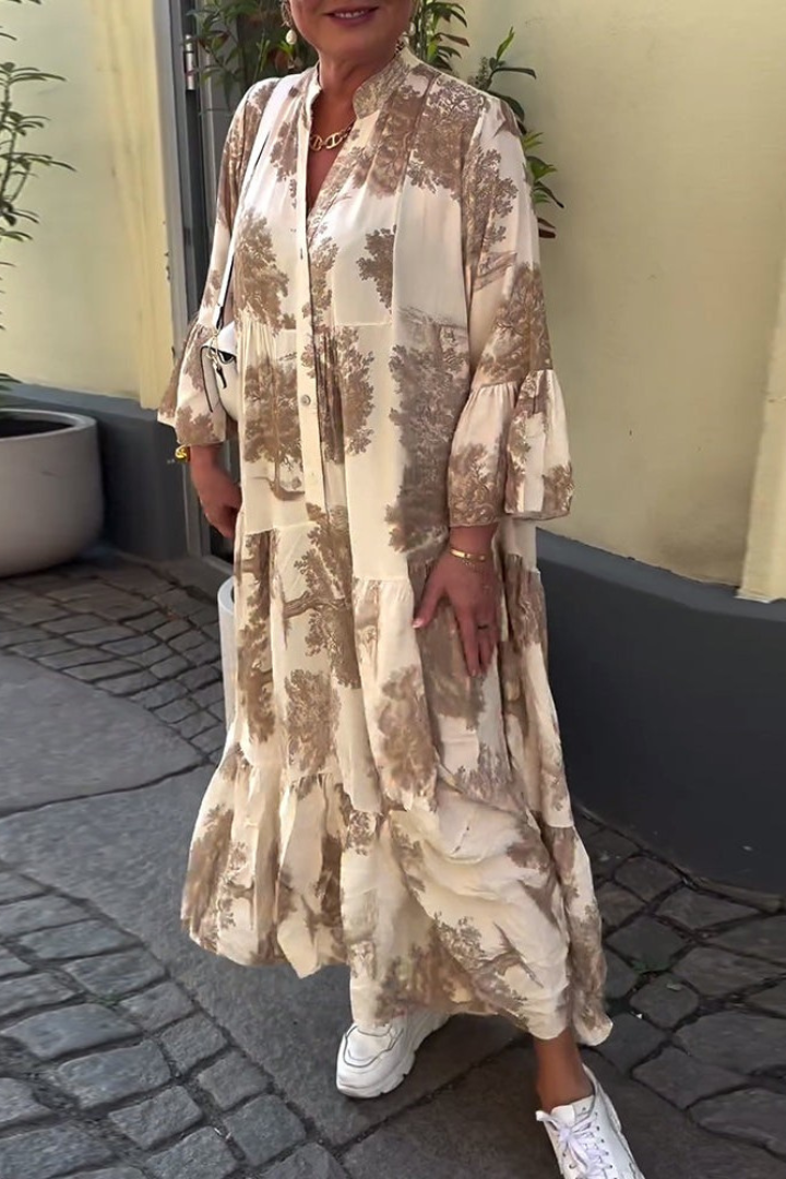 Full shot of woman wearing a light-colored Isla comfortable relaxed maxi dress, ideal for summer.