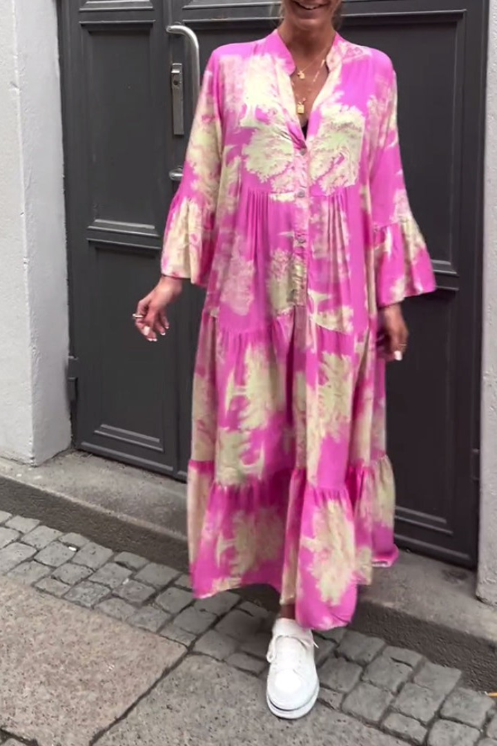 Model walking gracefully in the elegant and versatile Isla maxi dress, suitable for day or evening wear.