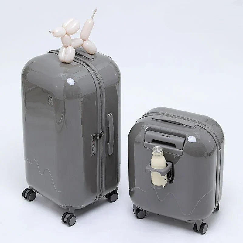 Colorful children's suitcase with easy-roll wheels, durable construction & fun design for young travelers.