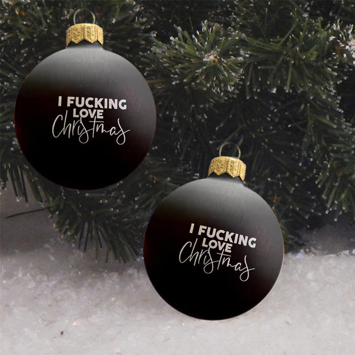 Close-up of a funny Christmas bauble with a witty saying for adult festive decor