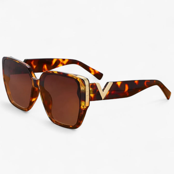 Punk-inspired V-shaped mirrored sunglasses. Unisex, bold, and futuristic eyewear for a unique fashion accessory.