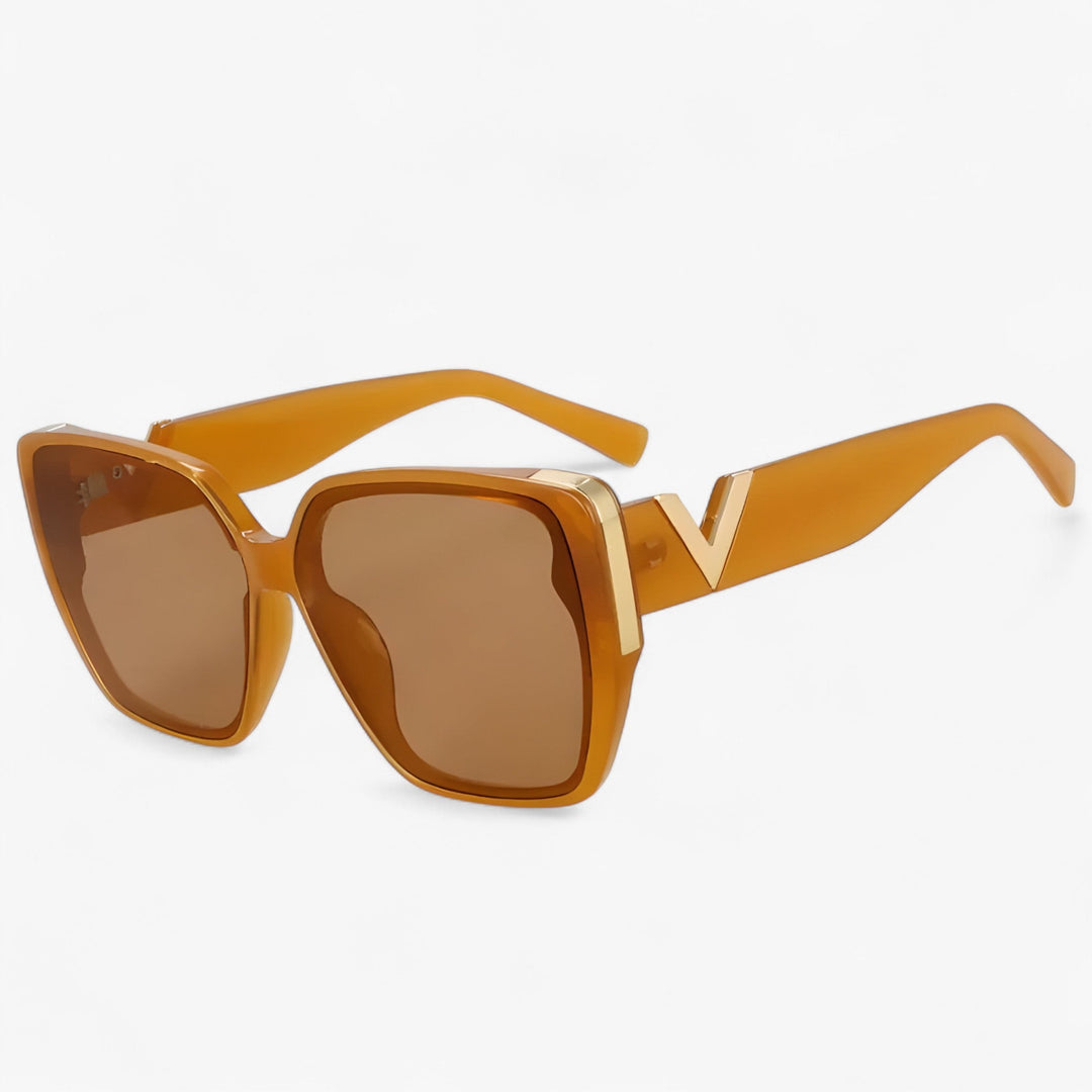 Trendy unisex V-shaped mirrored sunglasses. Geometric and futuristic fashion accessories for a bold statement look.