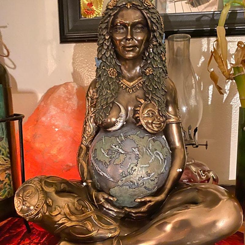 Detailed Gaia statue in bronze, depicting the interconnectedness of all life and mother earth's power