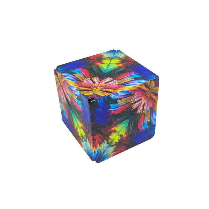 Hand holding a transforming geometric magnetic fidget cube, a versatile educational toy