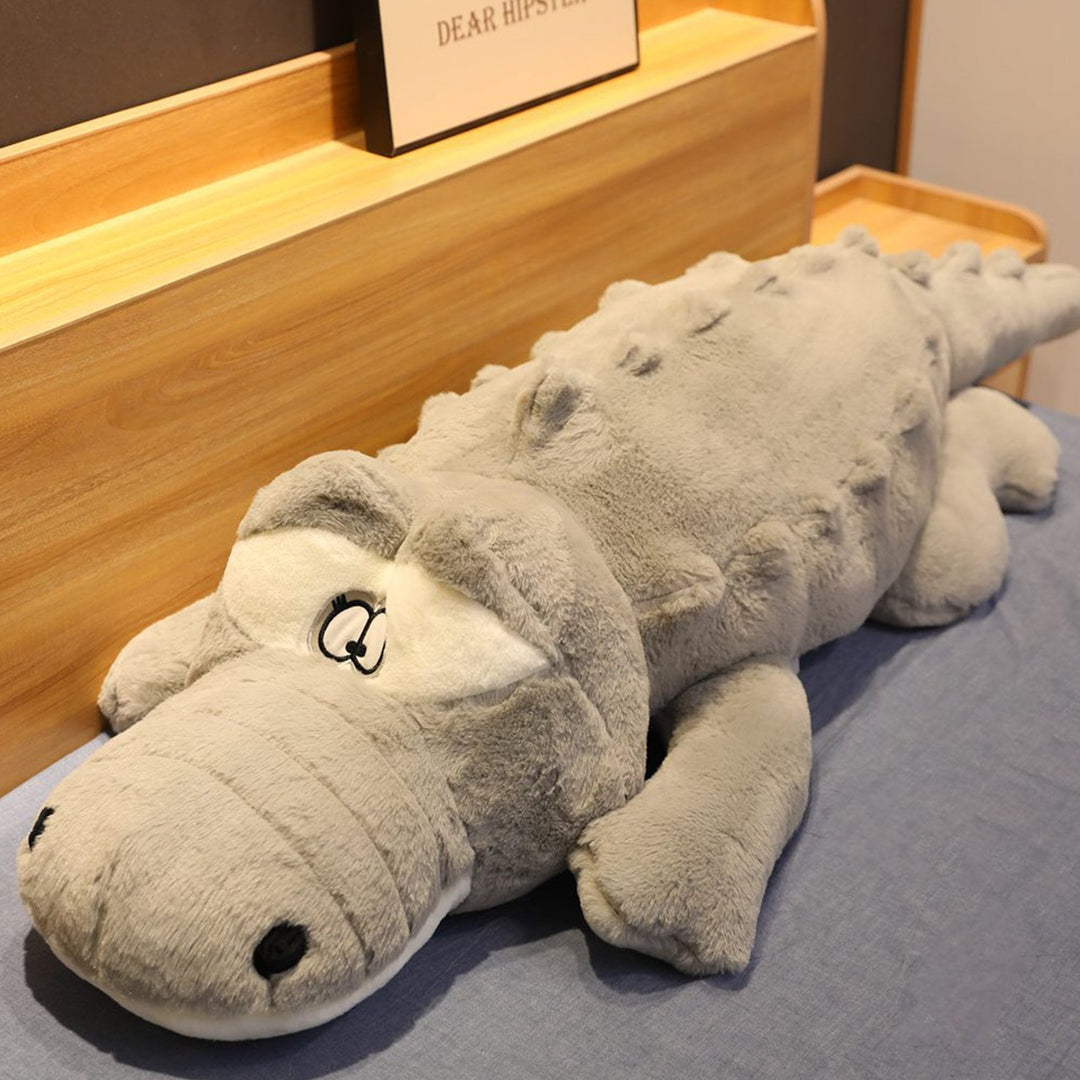 Oversized giant crocodile plush, a super soft & huggable companion. Hypoallergenic stuffed animal pillow for comfort.