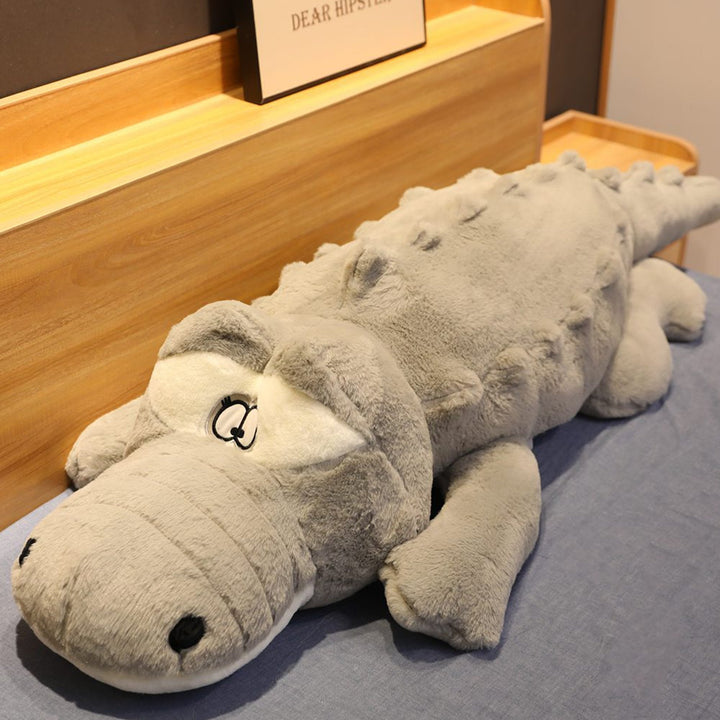 Oversized giant crocodile plush, a super soft & huggable companion. Hypoallergenic stuffed animal pillow for comfort.