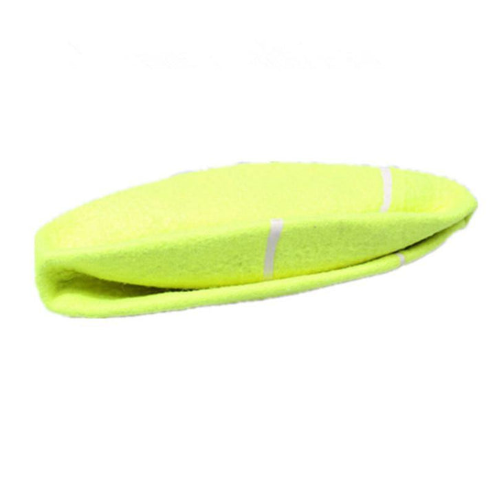 Large dog gripping a giant tennis ball dog toy, showcasing its fun for big pets.