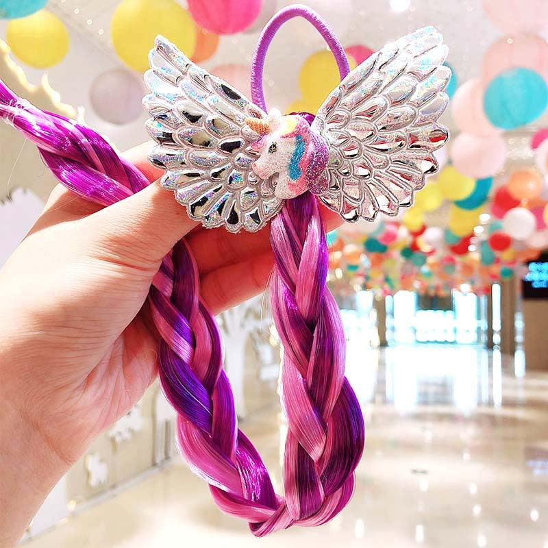 Girls' hair decorated with bright, multi-colored braided extensions for a festive look
