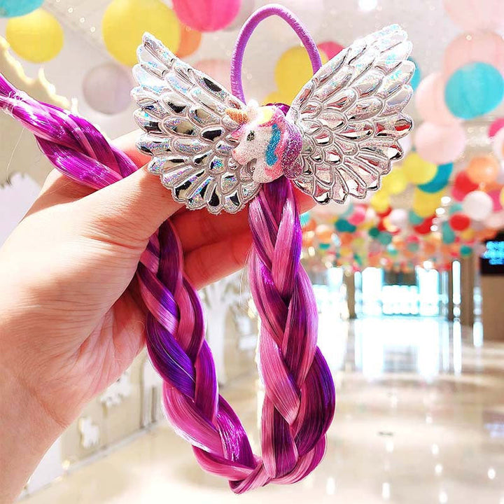 Girls' hair decorated with bright, multi-colored braided extensions for a festive look