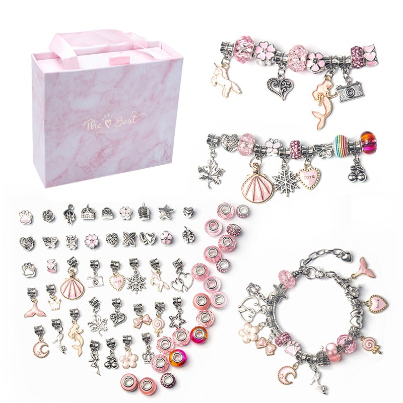 Child proudly displaying a custom-made charm bracelet from their DIY jewelry craft kit.