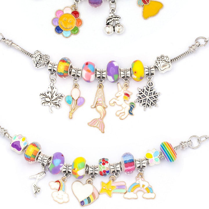 Girls' DIY Charm Bracelet Making Kit box with contents spilling out; beads, charms, and instructions.
