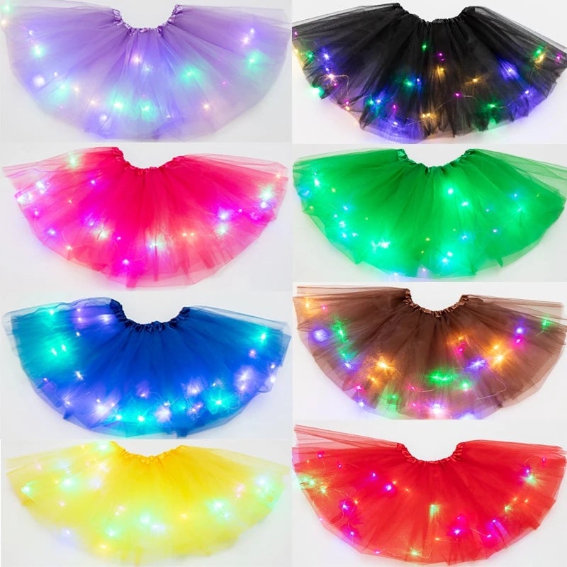 Group of girls wearing different colored LED tutu skirts, vibrant dance costumes, glowing