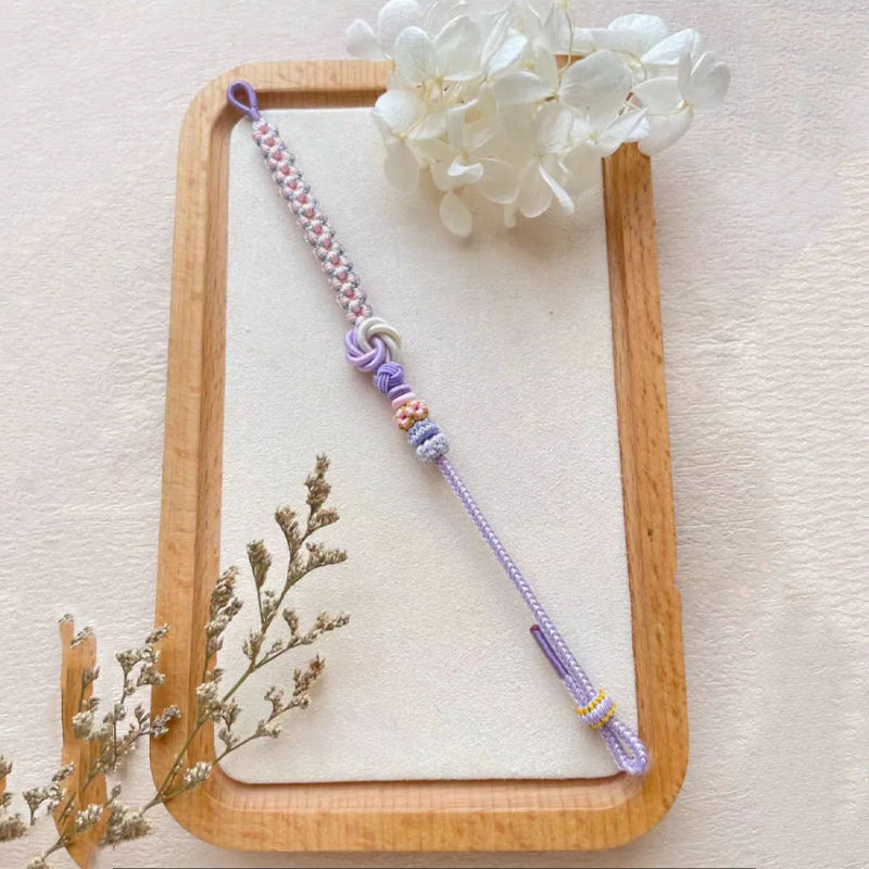 Child modeling a peach blossom knot braided bracelet, suitable for active kids, durable cord bracelet