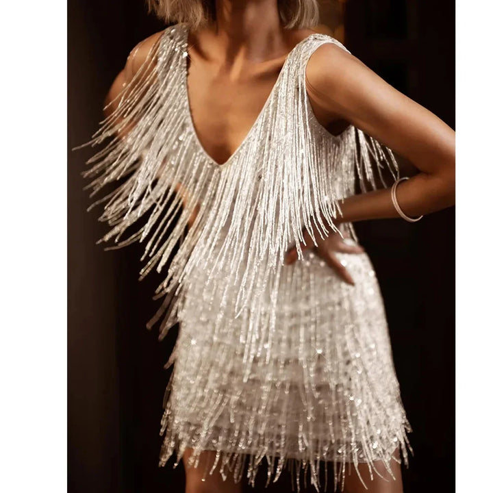 Stunning women's party dress featuring shimmering sequins and playful fringe accents