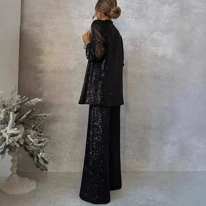 Chic women's sparkling sequin co-ord set featuring a top and high-waisted trousers for party wear.