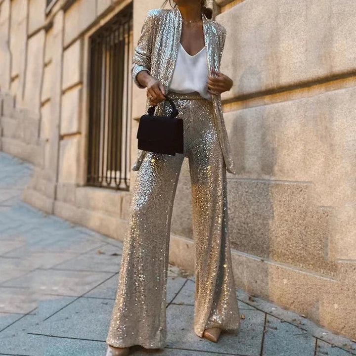 Sparkling women's sequin two-piece set, includes a chic top and flattering high-waisted pants.