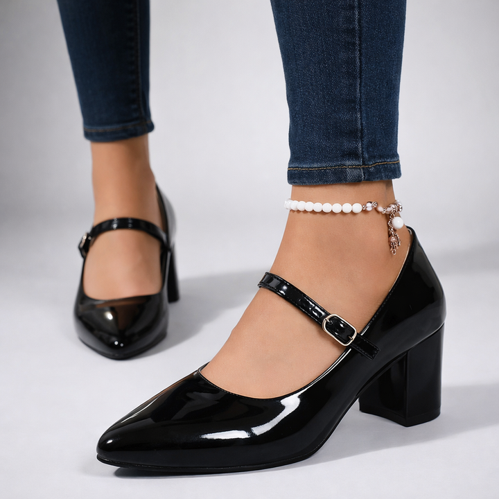 Pair of pink glossy block heel Mary Jane pumps, perfect for evening or dressy occasions.