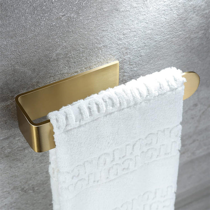 Silver adhesive towel holder, stainless steel, a stylish home organization solution.