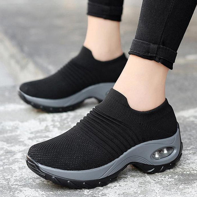 Stylish black women's breathable athletic sneakers with air cushion, great for outdoor wear.