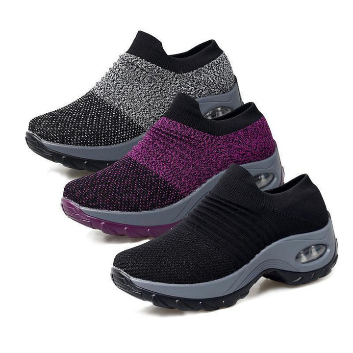 Red women's breathable outdoor footwear, stylish and supportive athletic sneakers.