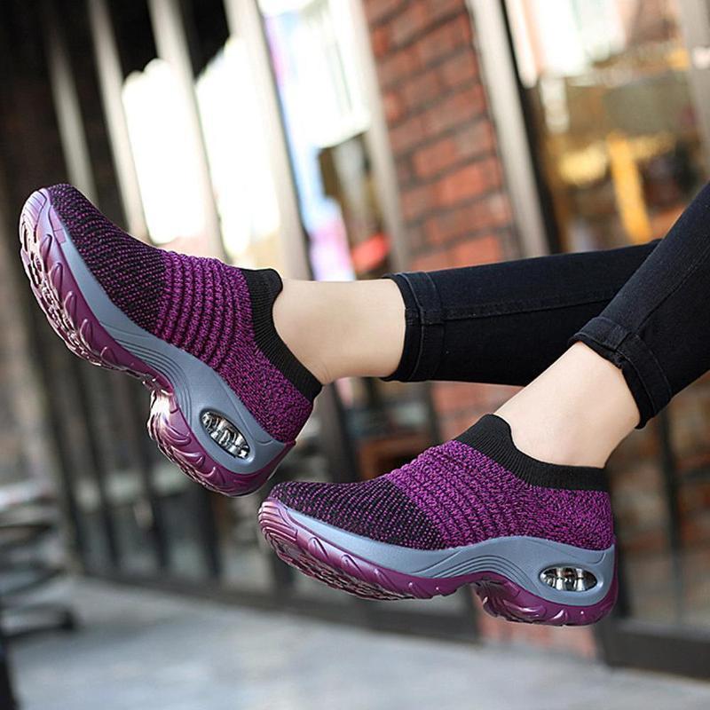 Sole view of black women's outdoor walking shoes, highlighting the air cushion technology.