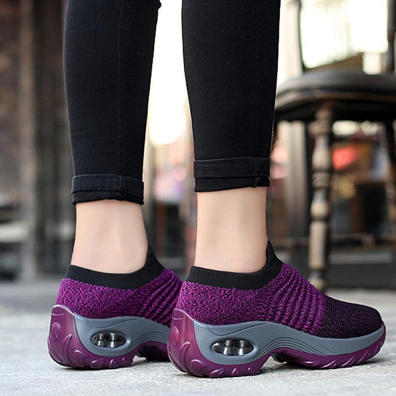 Side profile of red women's breathable sportswear shoes, designed for active women.