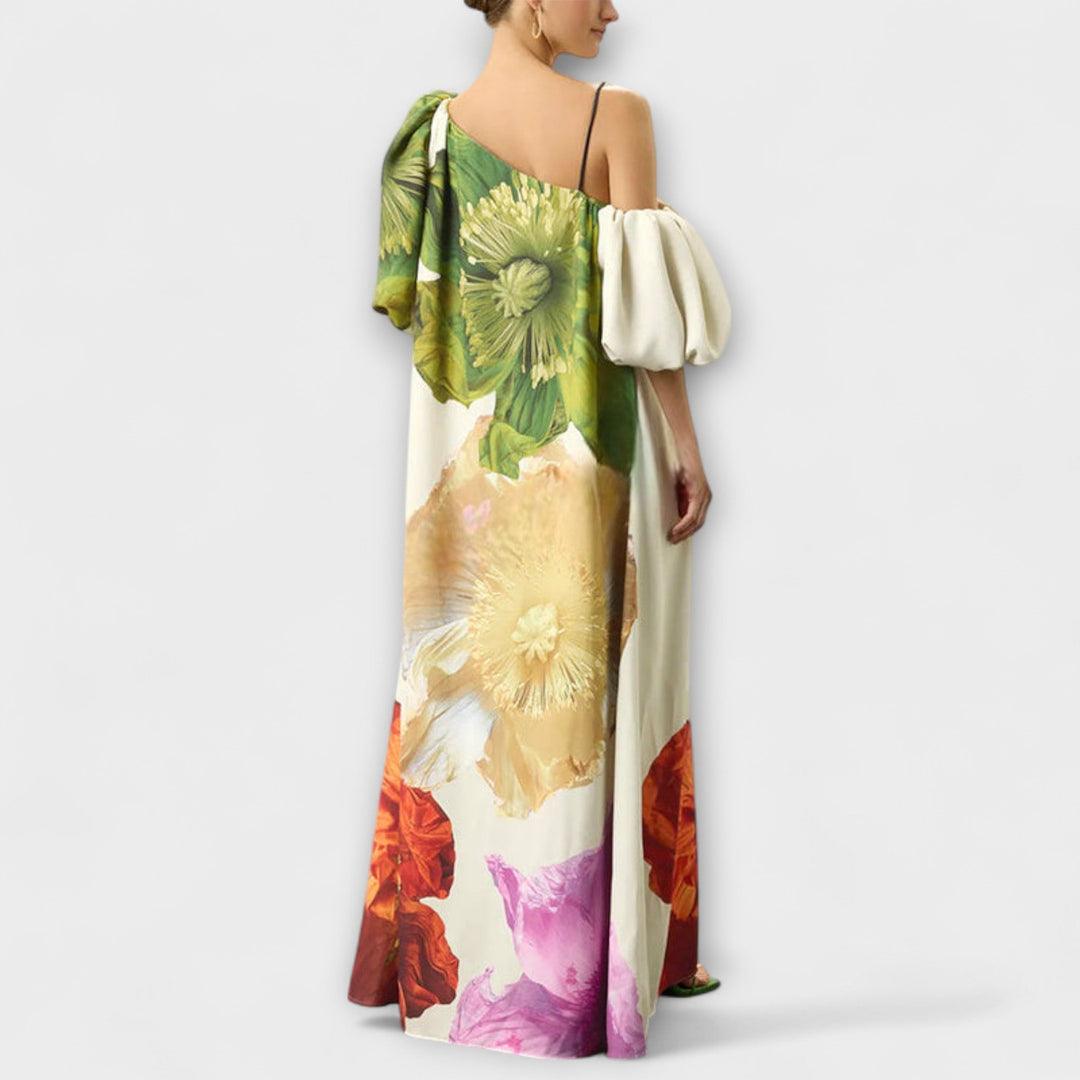 Flowy women's floral maxi dress in green, featuring a chic asymmetrical neckline, perfect for a comfortable vacation.