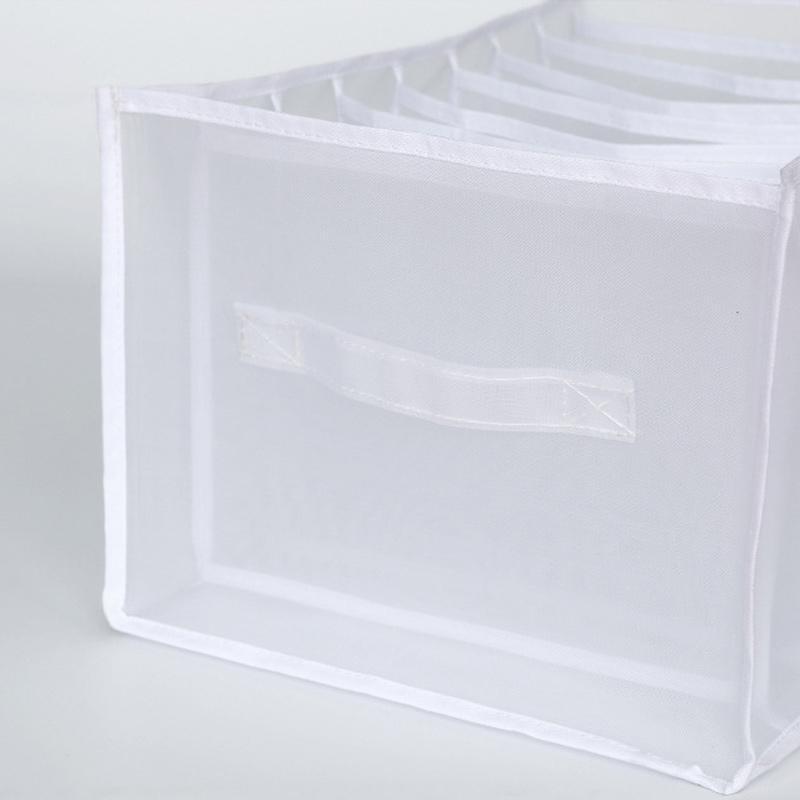 Close-up of the seams and durable construction of a mesh clothes organizer bin