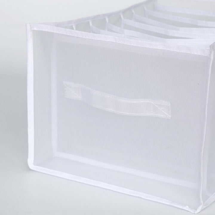 Close-up of the seams and durable construction of a mesh clothes organizer bin