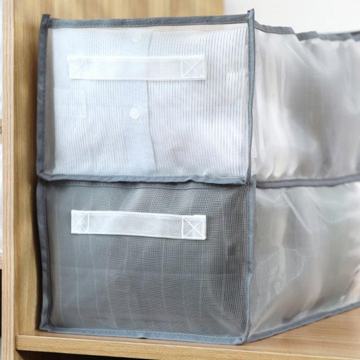 Detailed close-up of mesh fabric wardrobe organizer, showing breathable material