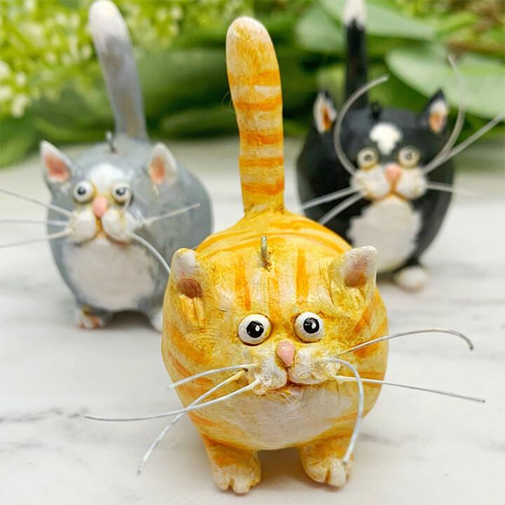Tiny handpainted cat figurine, a unique artisan sculpture and ideal gift for animal enthusiasts.