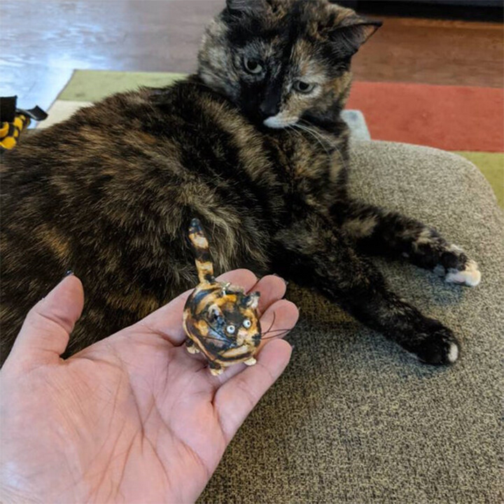 Adorable hand-painted kitty sculpture, a lovely decorative miniature for any pet-themed collection.
