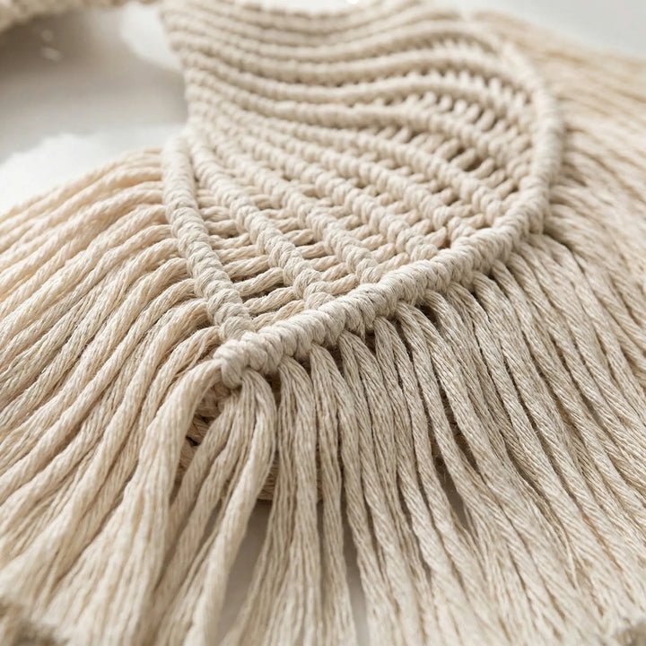 Neutral handcrafted macrame wall hanging, a bohemian textile art piece ideal for serene wall decor.