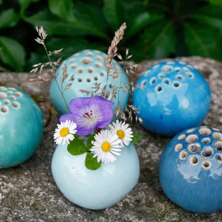Textured handmade resin mini vase adding a touch of rustic charm to any small space decoration