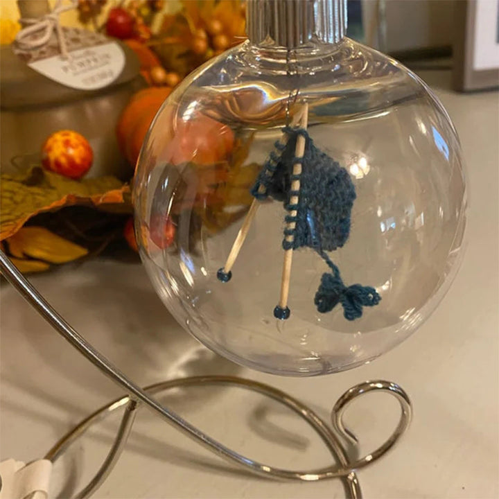 Close-up of a knitting-themed Christmas tree ornament, intricate yarn design, perfect for crafters