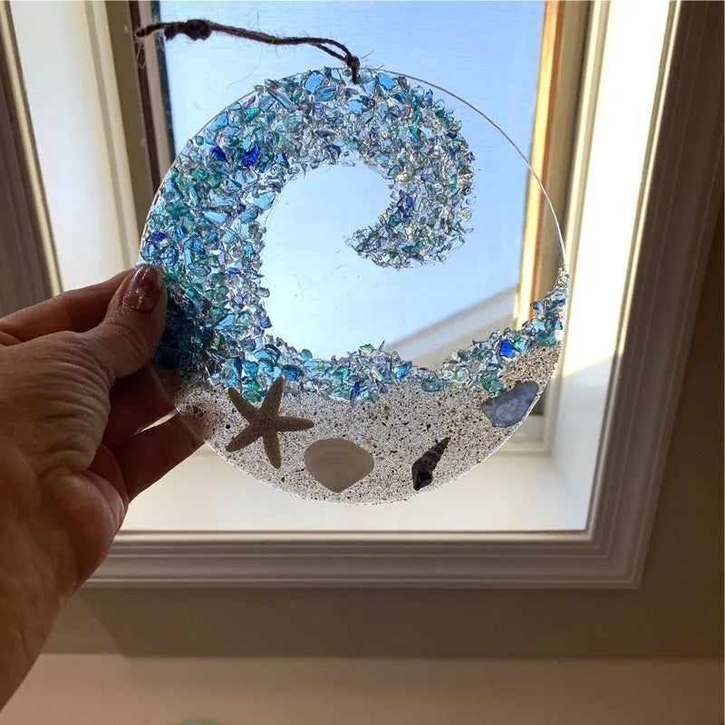 Close-up of ocean wave sea glass suncatcher, acrylic coastal home gift, vibrant colors