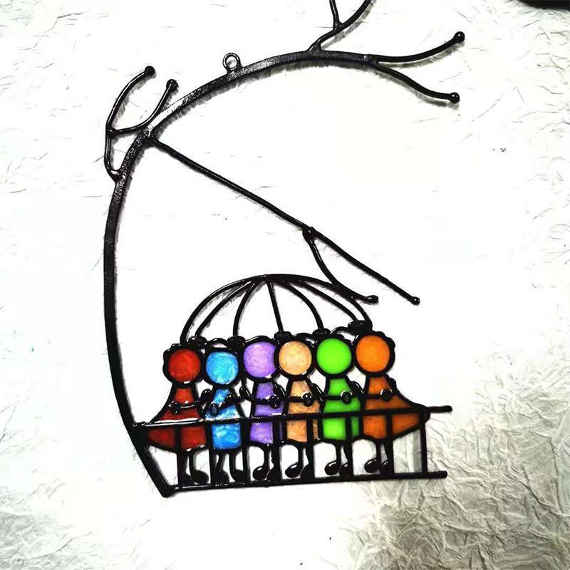 Angel-shaped stained glass suncatcher with vibrant colors, designed for window hanging or decorative display.